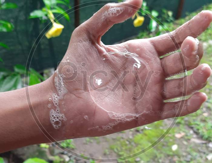 Soap bubble in hand