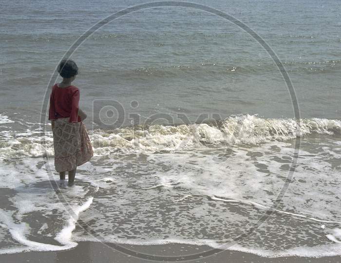 Girl Watching Waves