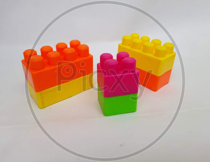 Plastic preschool colorful building blocks isolated on white background