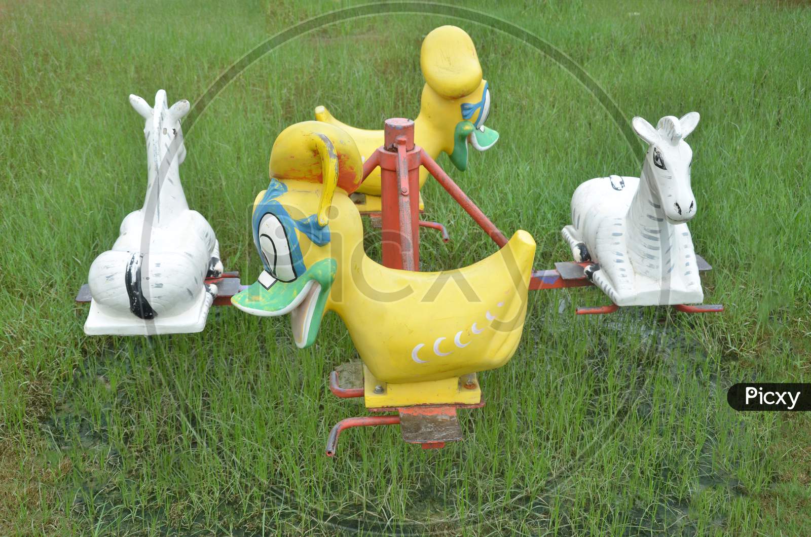 There are two duck puppets and two horse puppets used in a hammock. Hammock is uesd by children in the park.