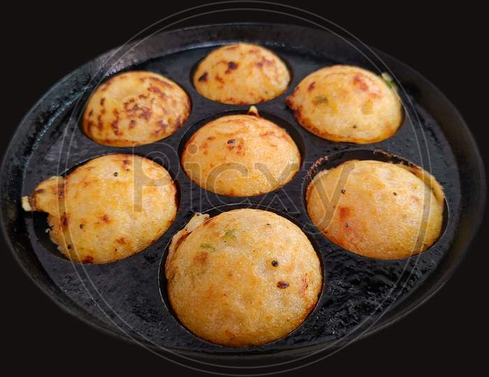 Paddu or Kuzhi paniyaram on the pan, the most favourite delicious food