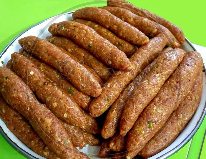 Handmade Marinated Kabab Rolls Isolated Green Background Mince Ginger Garlic Onion Spices Food