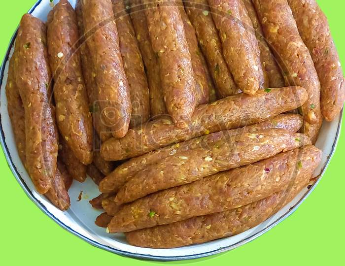 Handmade Marinated Kabab Rolls Isolated Green Background Mince Ginger Garlic Onion Spices Food