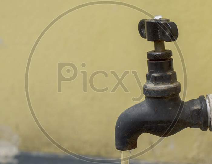 A Tap With Running Water Concept Of Water Wastage.