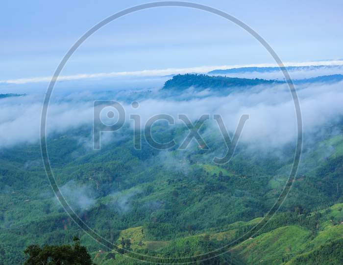 White clouds are floating over top of the green mountain in the morning  in Sajek, Bangladesh