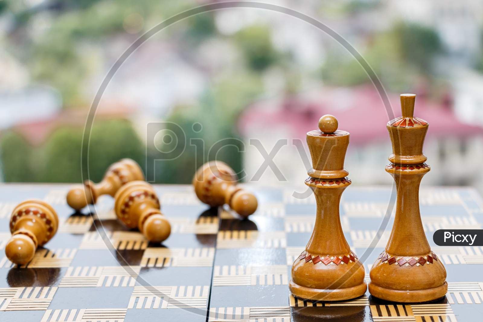 Chessboard with figures on a blurred background