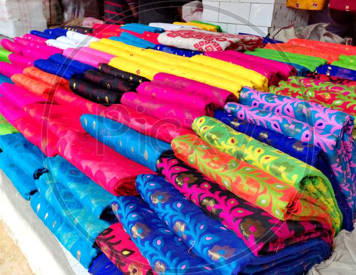 Indian women dress. sari Or saree in display of market. closeup view.