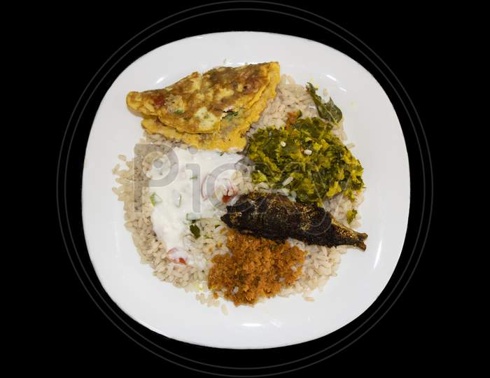 Kerala Style Lunch With Matta Rice And Dishes In Black Background