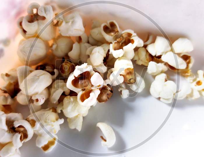 Some Popcorn In A White Box
