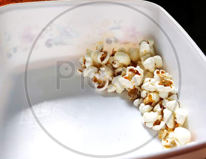 Some Popcorn In A White Box