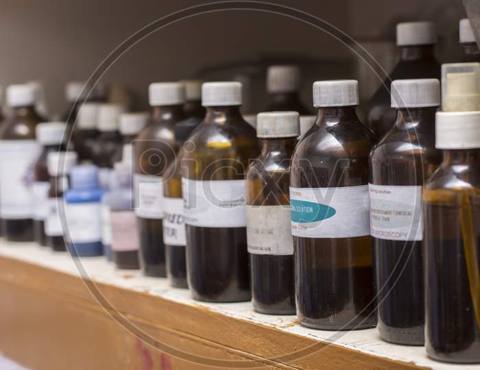 Different Types Of Bottles Of Solutions For Laboratory Tests With Selective Focus.