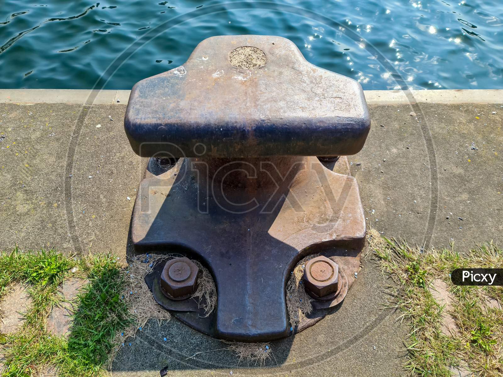 Different Bollards In Front Of The Water At The Port Of Kiel.
