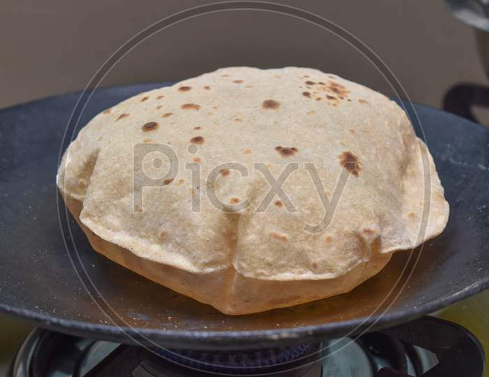 Phulka Chapati (Roti) On Non Stick Tawa.Indian Subcontinent Food.