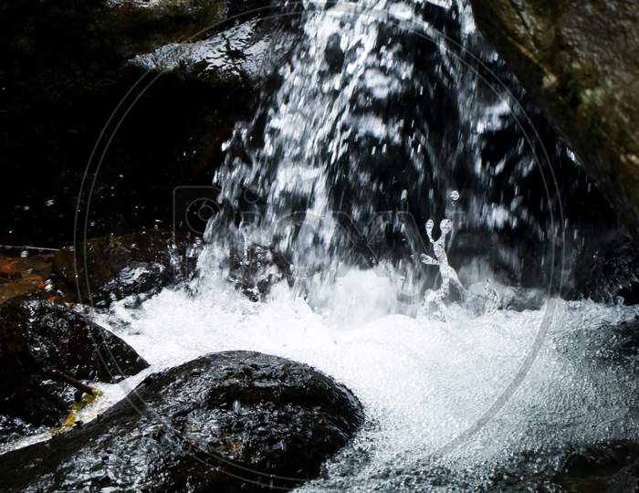 Water Splash From A Small Stream In The Forest