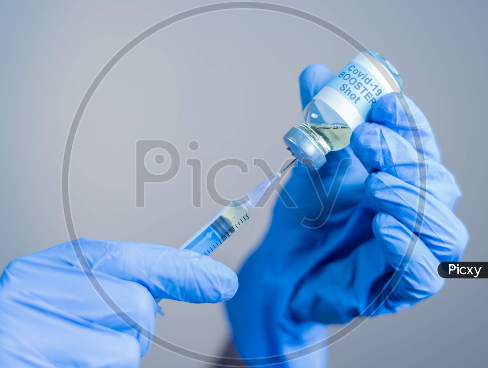 Focus On Syringe, Close Up Of Doctor Or Nurse Hands Taking Covid Vaccination Booster Shot Or 3Rd Dose From Syringe