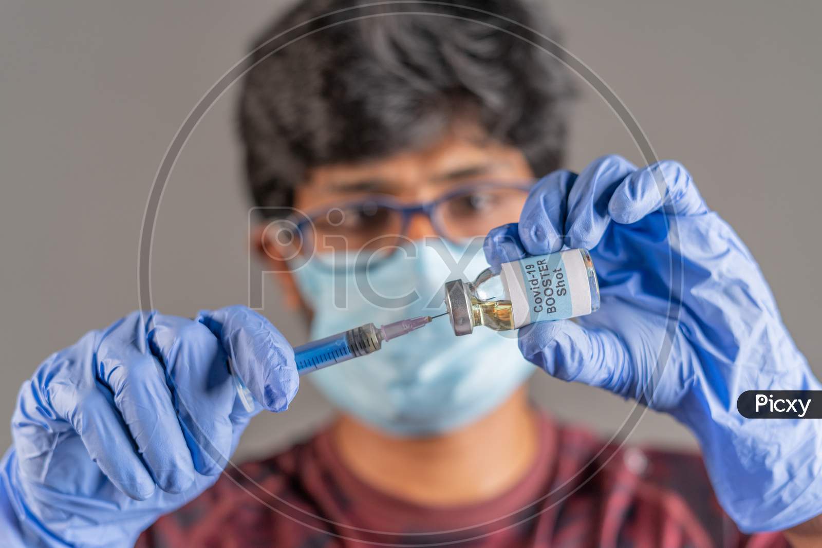 Close Up Of Doctor Hands Holding Covid-19 Vaccine Booster Shot With Syringe - Concept Of Coronavirus 3Rd Dose For Weakened Immune People.