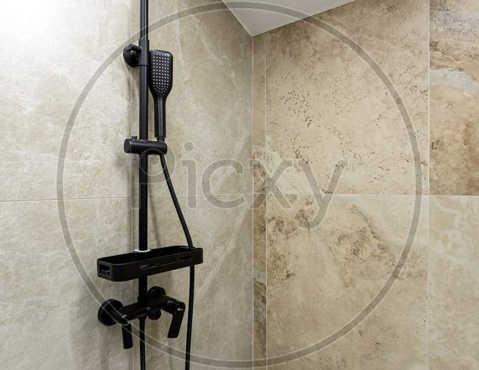 Bathroom In A Traditional Style With Brown And Beige Walls.Minimalist Shower Room With Hotel Sauna