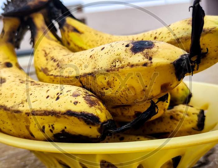 Ripe Yellow Bananas Fruits In A Basket , Bunch Of Ripe Bananas With Dark Spots