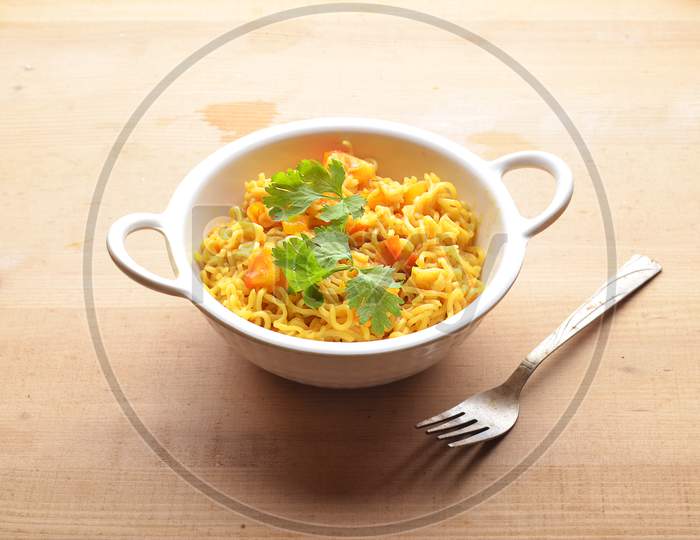 Maggi Food Ready To Eat on Wooden Background