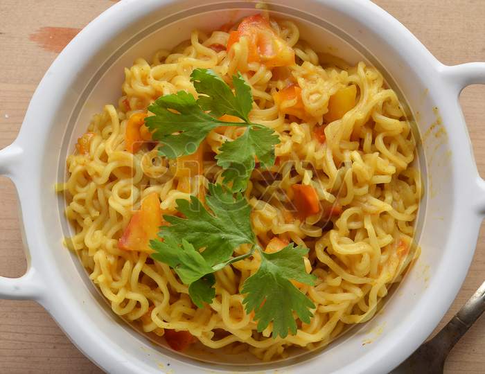 Maggi Food Ready To Eat on Wooden Background