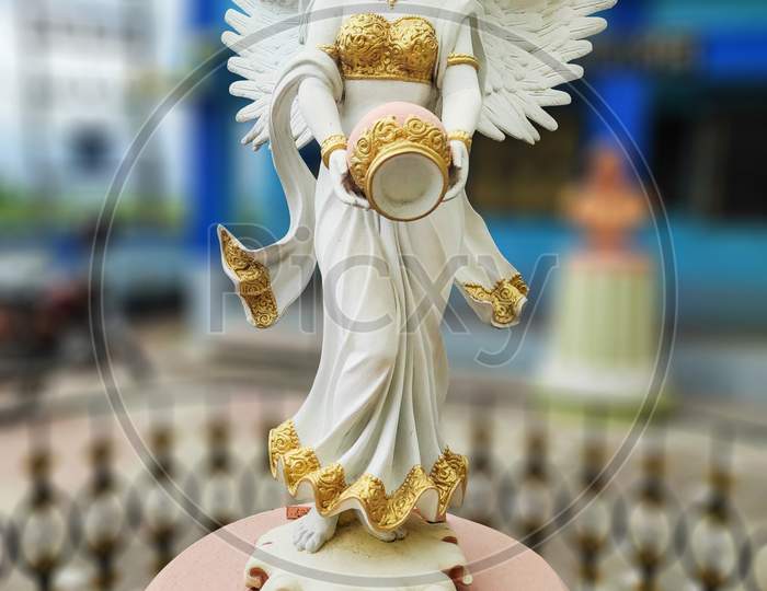 Statue Of A White Fairy Holding A Pitcher Made By The Artist Of West Bengal