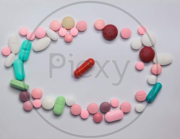 Colored Pills Or Drugs On A Neutral Background. Medicines For Legal Use.