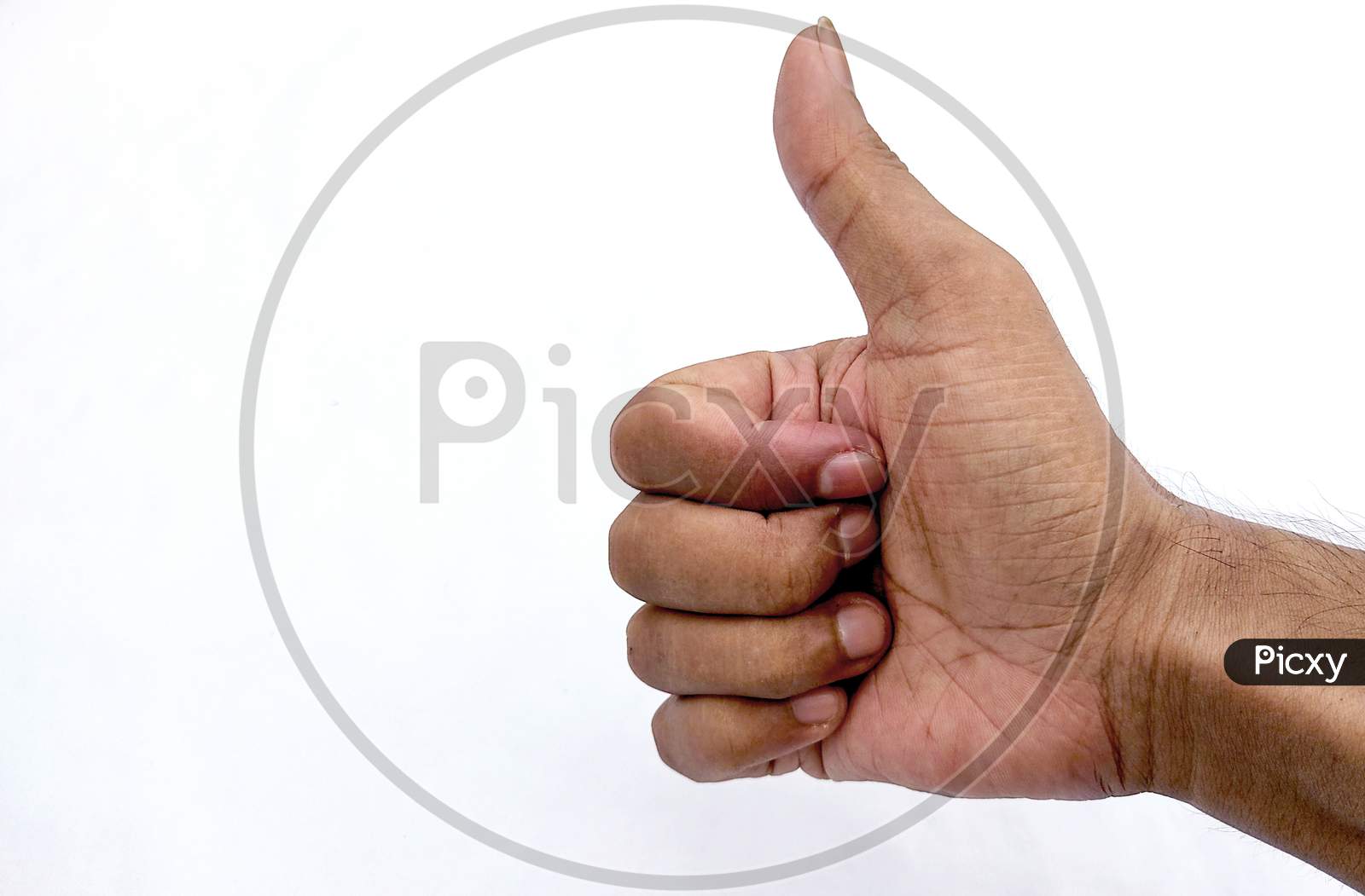 Closeup Of Male Hand Showing Thumbs Up Sign Against White Background