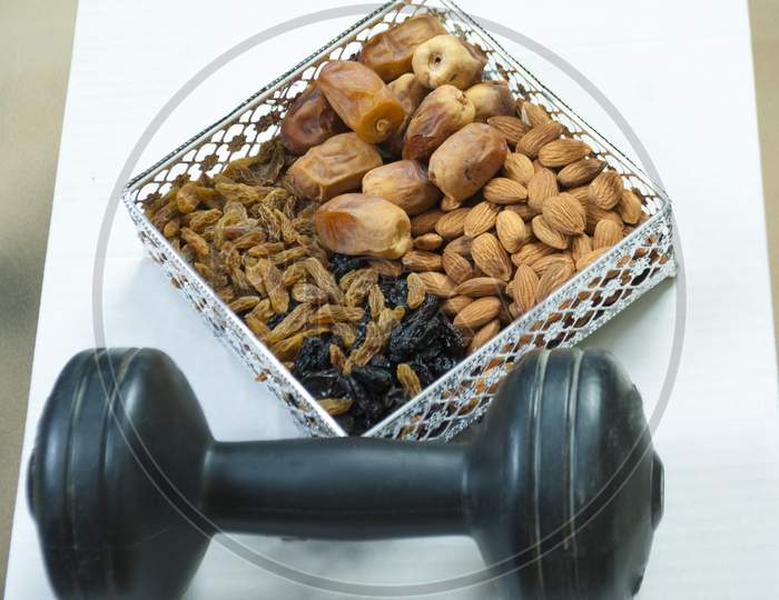 Gym Workout Food Organic Healthy Mix Dry Fruits With Dumbbell Golden And Black Raisins Dates Almonds