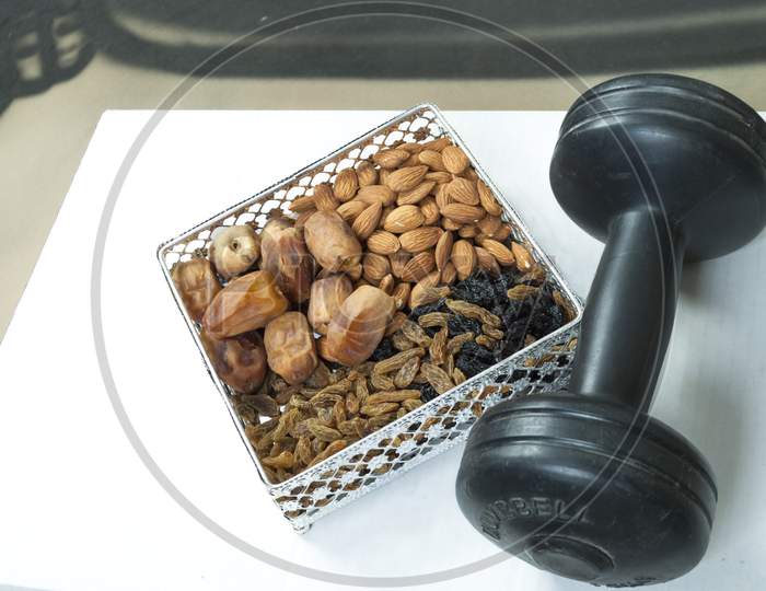 Gym Workout Food Organic Healthy Mix Dry Fruits With Dumbbell Golden And Black Raisins Dates Almonds