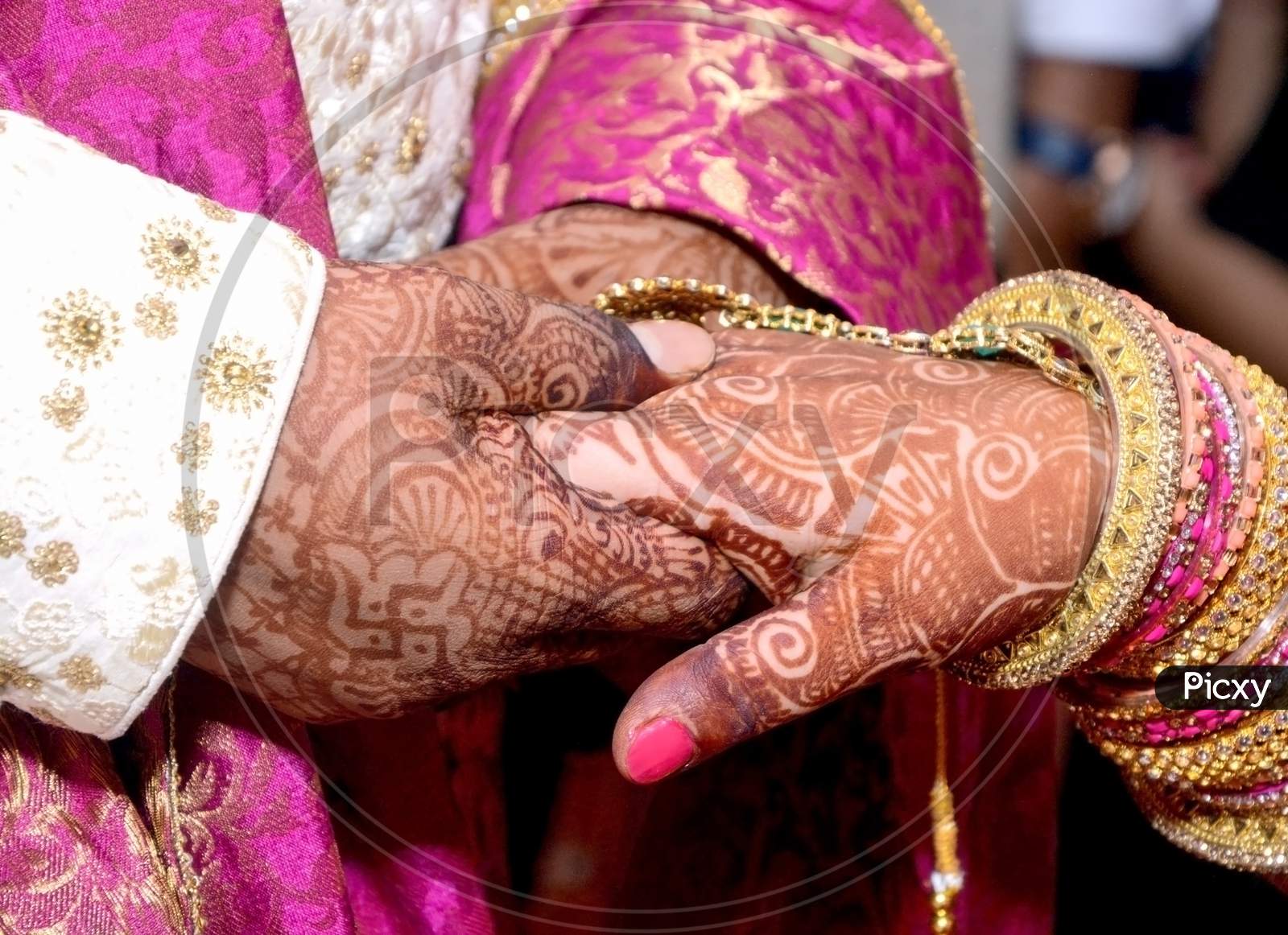 Closup Of Indian Young Adult Male Groom And Female Bride Holding Hands