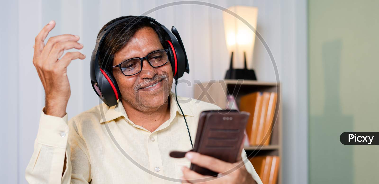 Happy Smiling Businessman Enjoying By Listening Music In Headphones At Office - Concept Of Taking Break, Relaxation While At Work