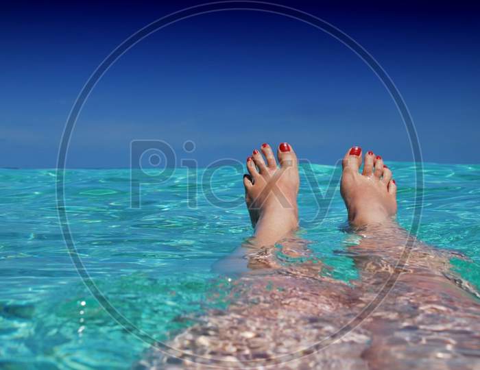 Beautiful Legs Swimming In The Sea
