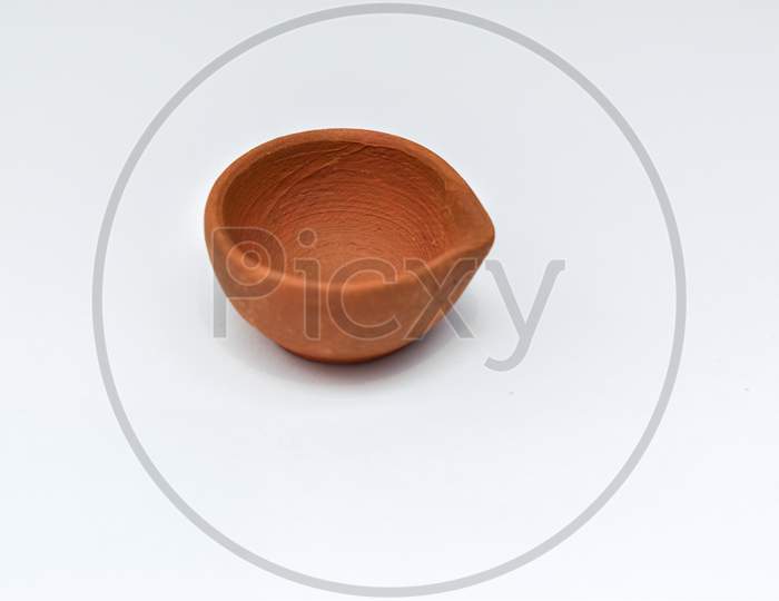 Indian Clay Oil Lamp Or Diya Used For Diwali And Festival Celebration With White Background