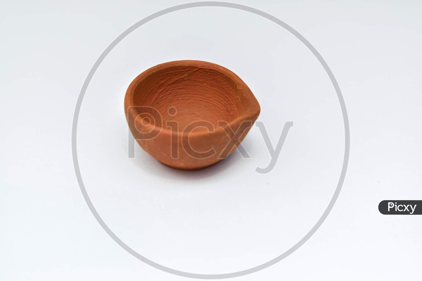 Indian Clay Oil Lamp Or Diya Used For Diwali And Festival Celebration With White Background