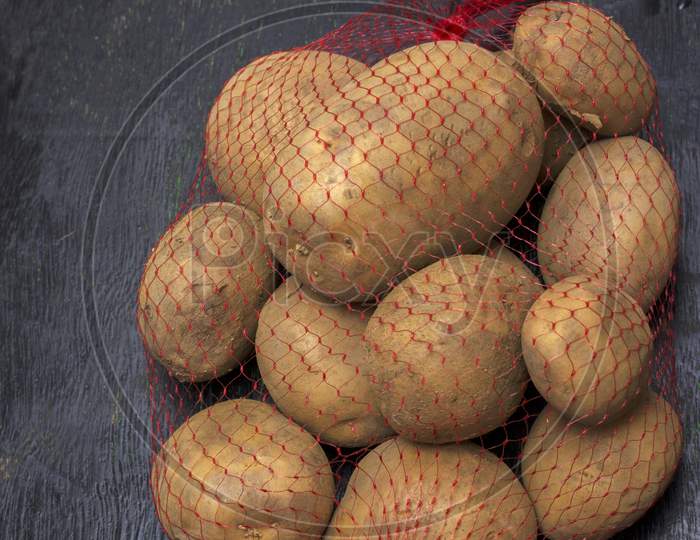 a bag full of organic fresh potatoes