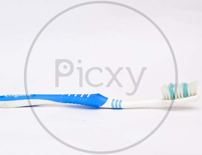 The Brush For Dental Care On A White Background.