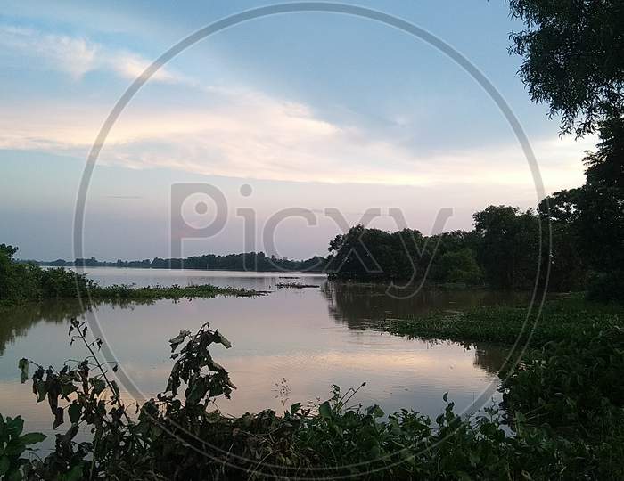The entire land is covered by flood water And the  scenario of nature makes it more beautiful, West Bengal, India