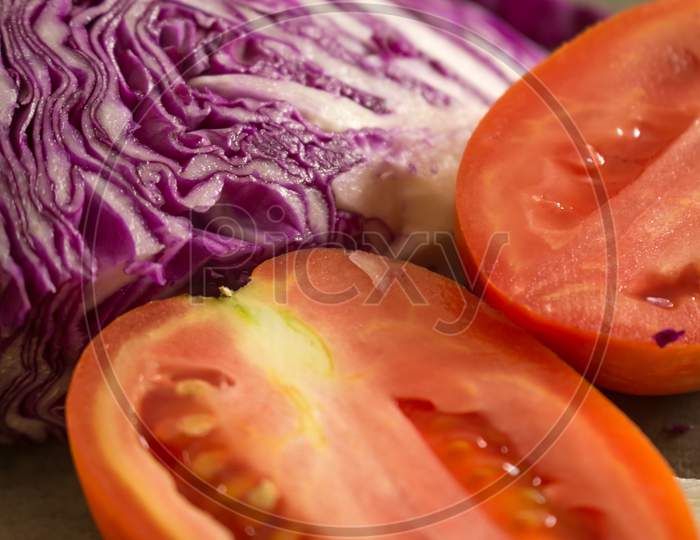Tomatoes Cut With Red Cabbage For Salad. Organic Vegan Food. Healthy Food.