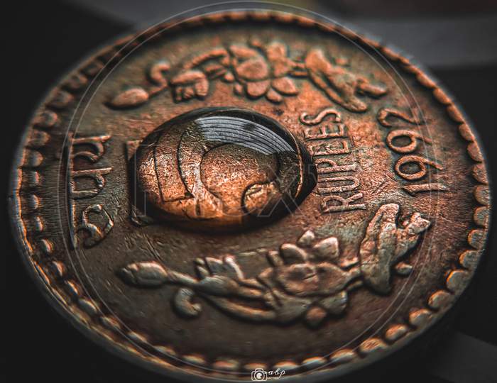 Water droplets on coin