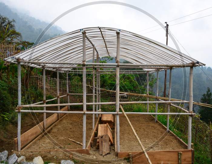 Greenhouse Under Construction With Plastic Roof.
