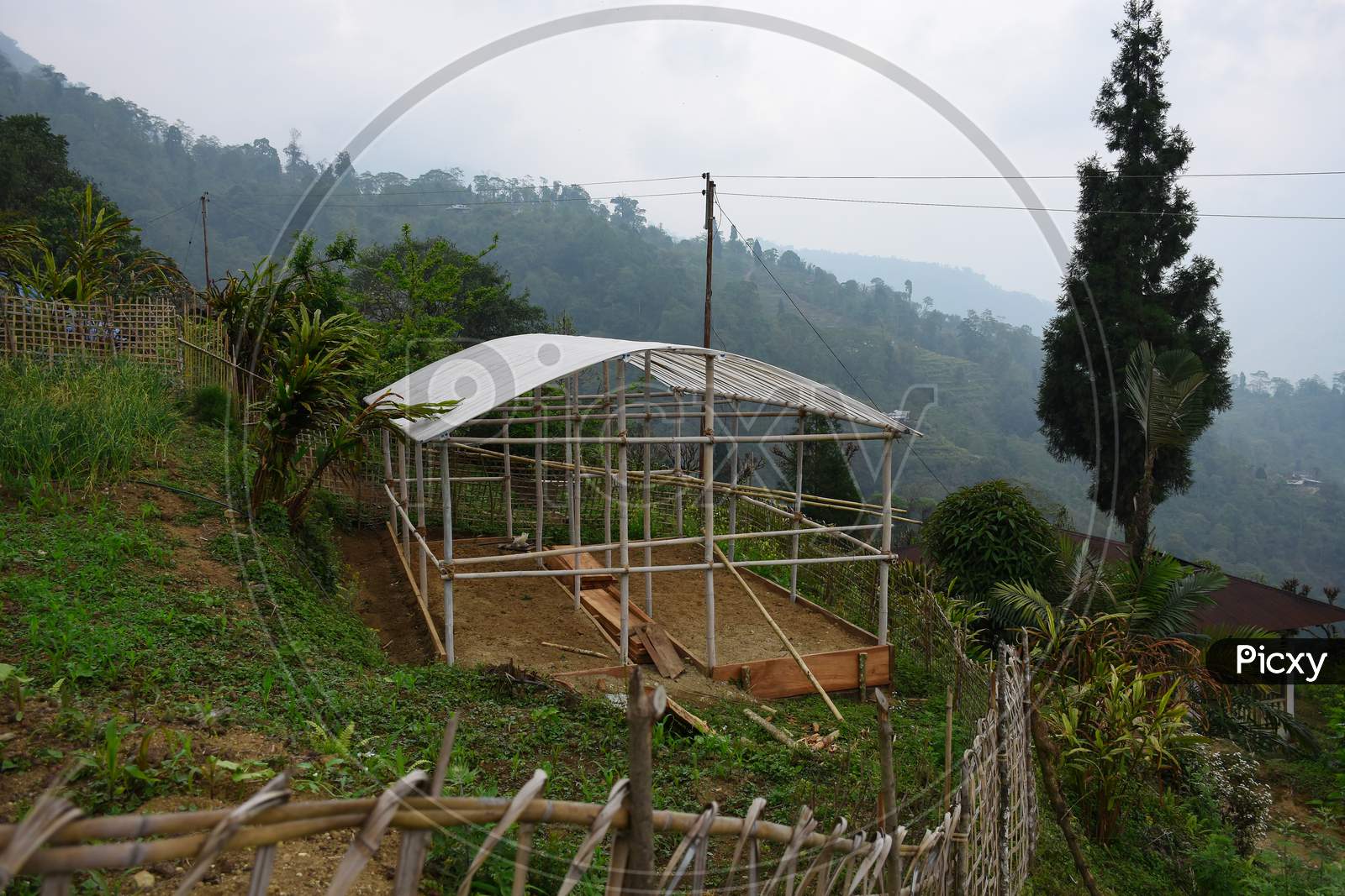 Greenhouse Under Construction With Plastic Roof.