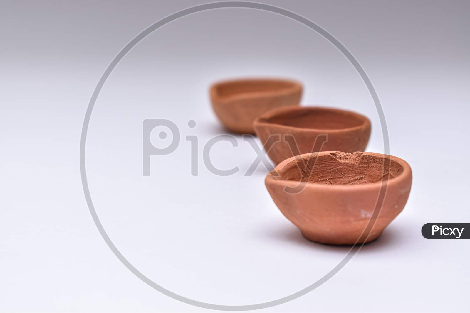 Indian Clay Diyas Or Oil Lamps In Series