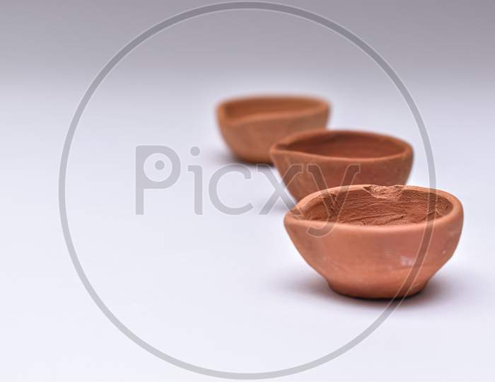 Indian Clay Diyas Or Oil Lamps In Series