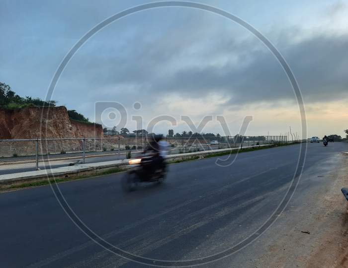 Motion Blurred Vehicle Moving In The National Highway Roads Of India