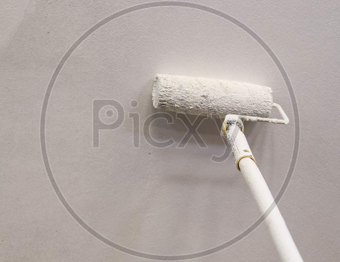 Paint Brush With Plastic Paint On The Sealing