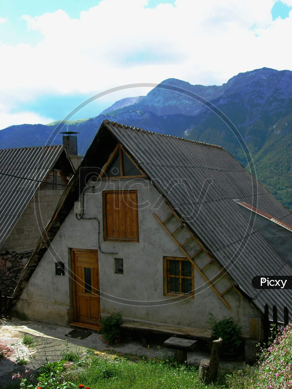 Beautiful typical house of the Aragonese Pyrenees, with its black roof and exaggerated slope