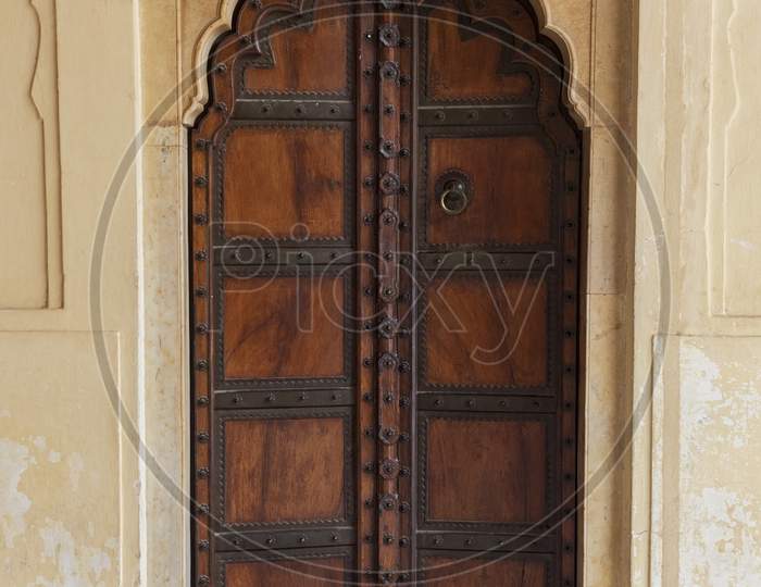 Traditional Ornamental Wooden Door In Amber Fort, Mughal Palace In Jaipur, India