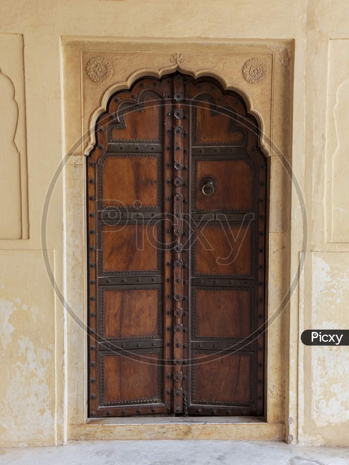 Traditional Ornamental Wooden Door In Amber Fort, Mughal Palace In Jaipur, India