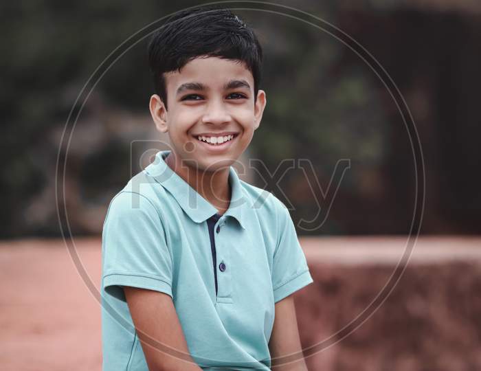 Portrait Of Happy Little Indian Boy Smiling, Indian Child Outdoor Location.