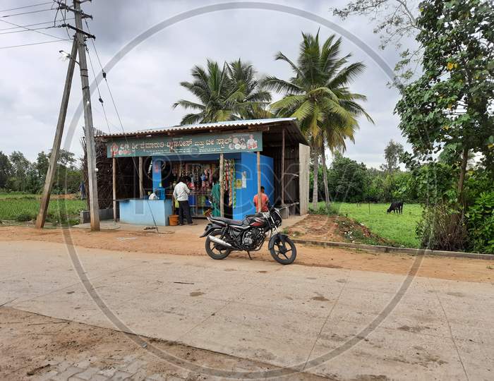 Closeup Of Small Village Roadside Tea Shop Or Store Building With Nature,Agriculture Field Background